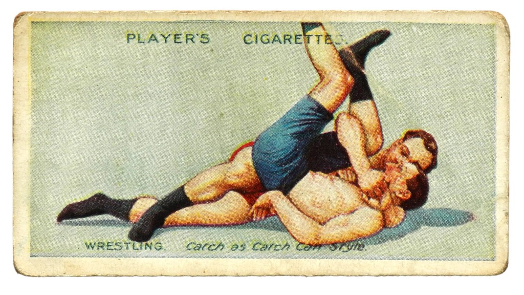 The Cradle Hold, No 8 in a series of 25 wrestling and ju-jitsu cards released by British cigarette company John Player & Sons in the 1930s.